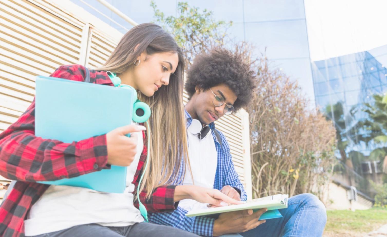 Hands reviewing personal budget spreadsheet